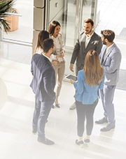 Five people gathering for a meeting
